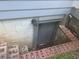 Exterior view of the basement entrance with brick trim at 2530 Old Colony Rd, East Point, GA 30344