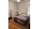 Simple bedroom with hardwood floors and a large window offering natural light at 2530 Old Colony Rd, East Point, GA 30344