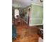 Open-concept dining area with wood floors, leading to additional living spaces at 2530 Old Colony Rd, East Point, GA 30344