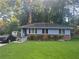 Charming single-story home featuring a well-maintained lawn and classic brick accents at 2530 Old Colony Rd, East Point, GA 30344