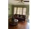 Comfortable living room featuring neutral walls, hardwood flooring, and ample natural light from windows at 2530 Old Colony Rd, East Point, GA 30344