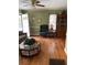 Cozy living room with hardwood floors, complemented by natural light and a ceiling fan at 2530 Old Colony Rd, East Point, GA 30344