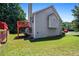 Backyard with green lawn and house exterior featuring a wooden deck at 4426 High Gate Nw Dr, Acworth, GA 30101