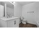 Well-lit bathroom with a modern vanity, fixtures, and tiled floor at 4426 High Gate Nw Dr, Acworth, GA 30101