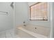 Bright bathroom showcasing a soaking tub with window at 4426 High Gate Nw Dr, Acworth, GA 30101