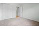 Bedroom with neutral carpet, closet, and doorway to another room at 4426 High Gate Nw Dr, Acworth, GA 30101