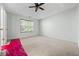 Spacious bedroom with a ceiling fan and large window at 4426 High Gate Nw Dr, Acworth, GA 30101