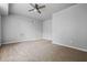 Neutral bedroom with a ceiling fan, carpet flooring, and ample natural light at 4426 High Gate Nw Dr, Acworth, GA 30101