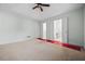 Expansive bedroom features a ceiling fan, closet, and an attached bathroom for comfort and privacy at 4426 High Gate Nw Dr, Acworth, GA 30101