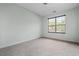 Bedroom features neutral carpet and a bright window view at 4426 High Gate Nw Dr, Acworth, GA 30101