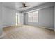 Spacious bedroom featuring neutral walls, carpet flooring, and a window at 4426 High Gate Nw Dr, Acworth, GA 30101