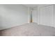 Bedroom with neutral carpet, closet, and doorway to another room at 4426 High Gate Nw Dr, Acworth, GA 30101