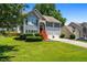 Charming two-story home with a well-manicured lawn and beautiful landscaping at 4426 High Gate Nw Dr, Acworth, GA 30101