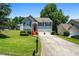 Exterior view of a two-story house with a well-maintained lawn at 4426 High Gate Nw Dr, Acworth, GA 30101