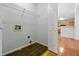Practical laundry room with tiled floors, shelving, and connections for a washer and dryer for added convenience at 4426 High Gate Nw Dr, Acworth, GA 30101