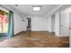 Bright living room with wood floors, a sliding glass door, and access to storage at 4426 High Gate Nw Dr, Acworth, GA 30101