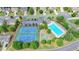 Aerial view of community featuring tennis courts, basketball court, and pool at 450 Hilingdon Way, Suwanee, GA 30024