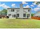 Well maintained backyard featuring grass, patio, and mature trees at 450 Hilingdon Way, Suwanee, GA 30024