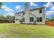 Backyard featuring a stone retaining wall at 450 Hilingdon Way, Suwanee, GA 30024