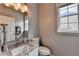 Bathroom featuring granite countertops and modern fixtures at 450 Hilingdon Way, Suwanee, GA 30024