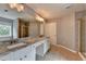 Bathroom with granite countertops, dual sinks, shower, and tub at 450 Hilingdon Way, Suwanee, GA 30024