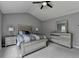 Comfortable primary bedroom featuring high ceilings and decorative furniture at 450 Hilingdon Way, Suwanee, GA 30024