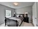 Bedroom featuring a bed with gray bedding at 450 Hilingdon Way, Suwanee, GA 30024