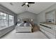 Bedroom with vaulted ceilings, a ceiling fan, and large windows providing ample light at 450 Hilingdon Way, Suwanee, GA 30024