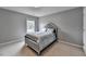 Bedroom with plush carpet, high ceilings, and a double bed at 450 Hilingdon Way, Suwanee, GA 30024