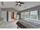 Bedroom featuring an ensuite bathroom, walk-in closet, and large windows at 450 Hilingdon Way, Suwanee, GA 30024
