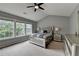 Bedroom with vaulted ceilings, a ceiling fan, and large windows providing ample light at 450 Hilingdon Way, Suwanee, GA 30024