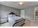 Bedroom featuring a bed and entry to another room at 450 Hilingdon Way, Suwanee, GA 30024