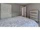 Bedroom featuring a bed and a set of doors at 450 Hilingdon Way, Suwanee, GA 30024