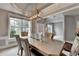 Dining room featuring a modern light fixture and window view at 450 Hilingdon Way, Suwanee, GA 30024