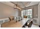 Dining room featuring a modern chandelier and natural light at 450 Hilingdon Way, Suwanee, GA 30024