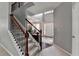 Welcoming entryway featuring a staircase, hardwood floors, and an open floor plan at 450 Hilingdon Way, Suwanee, GA 30024