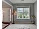 Bright foyer featuring a decorative front door with sidelights and a view to the outside at 450 Hilingdon Way, Suwanee, GA 30024