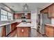 Kitchen features granite counters, stainless steel appliances, and a center island at 450 Hilingdon Way, Suwanee, GA 30024