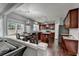 Beautiful kitchen features a dining area and rich, dark wood cabinetry at 450 Hilingdon Way, Suwanee, GA 30024