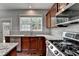 Granite counters and stainless steel appliances make this kitchen shine at 450 Hilingdon Way, Suwanee, GA 30024