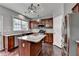 Kitchen with granite countertops, stainless steel appliances, and central island at 450 Hilingdon Way, Suwanee, GA 30024