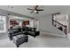 Living room featuring a staircase, TV and furniture at 450 Hilingdon Way, Suwanee, GA 30024