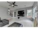 Living room featuring a TV, staircase and fireplace at 450 Hilingdon Way, Suwanee, GA 30024