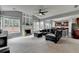 Spacious living room with fireplace, vaulted ceilings, and a comfortable leather sofa at 450 Hilingdon Way, Suwanee, GA 30024