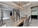 Dining room with neutral decor, modern chandelier, and lots of natural light at 450 Hilingdon Way, Suwanee, GA 30024