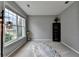 Living room features a large window, neutral paint, and a furry rug at 450 Hilingdon Way, Suwanee, GA 30024