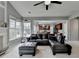 Comfortable living room with a leather sofa and view into the kitchen at 450 Hilingdon Way, Suwanee, GA 30024