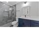 Bathroom featuring a glass shower with tile surround, marble countertops, and modern fixtures at 4847 Royal Dr, Duluth, GA 30096