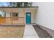 Charming front porch with natural wood railing and a vibrant blue front door at 4847 Royal Dr, Duluth, GA 30096
