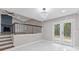 Bright living room featuring a fireplace, access to the yard and neutral walls at 4847 Royal Dr, Duluth, GA 30096